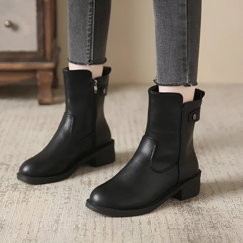 Women's black low heel round toe side zip ankle boots showing front and side views