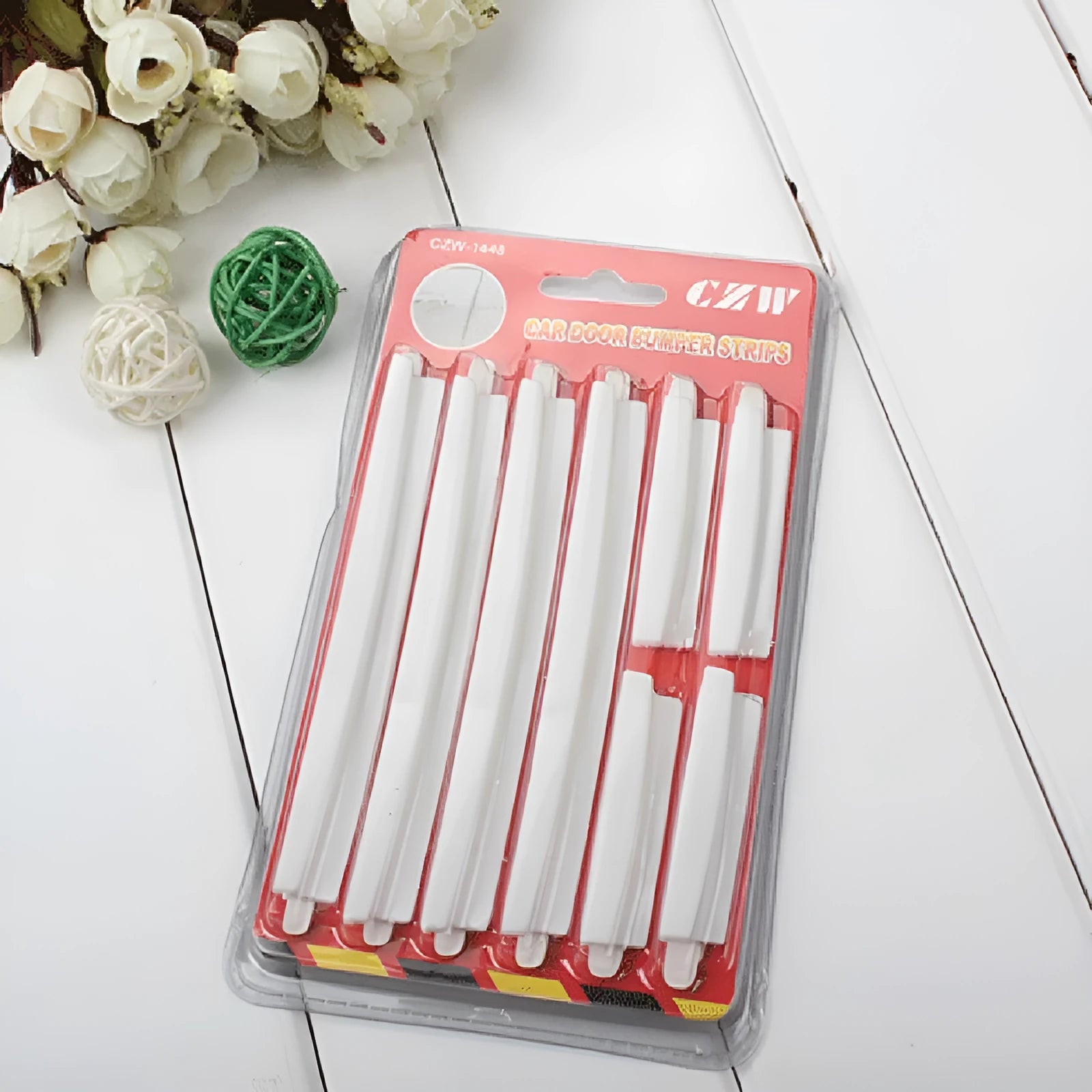 Solid white plastic car door edge protection bumper strip, one set shown.