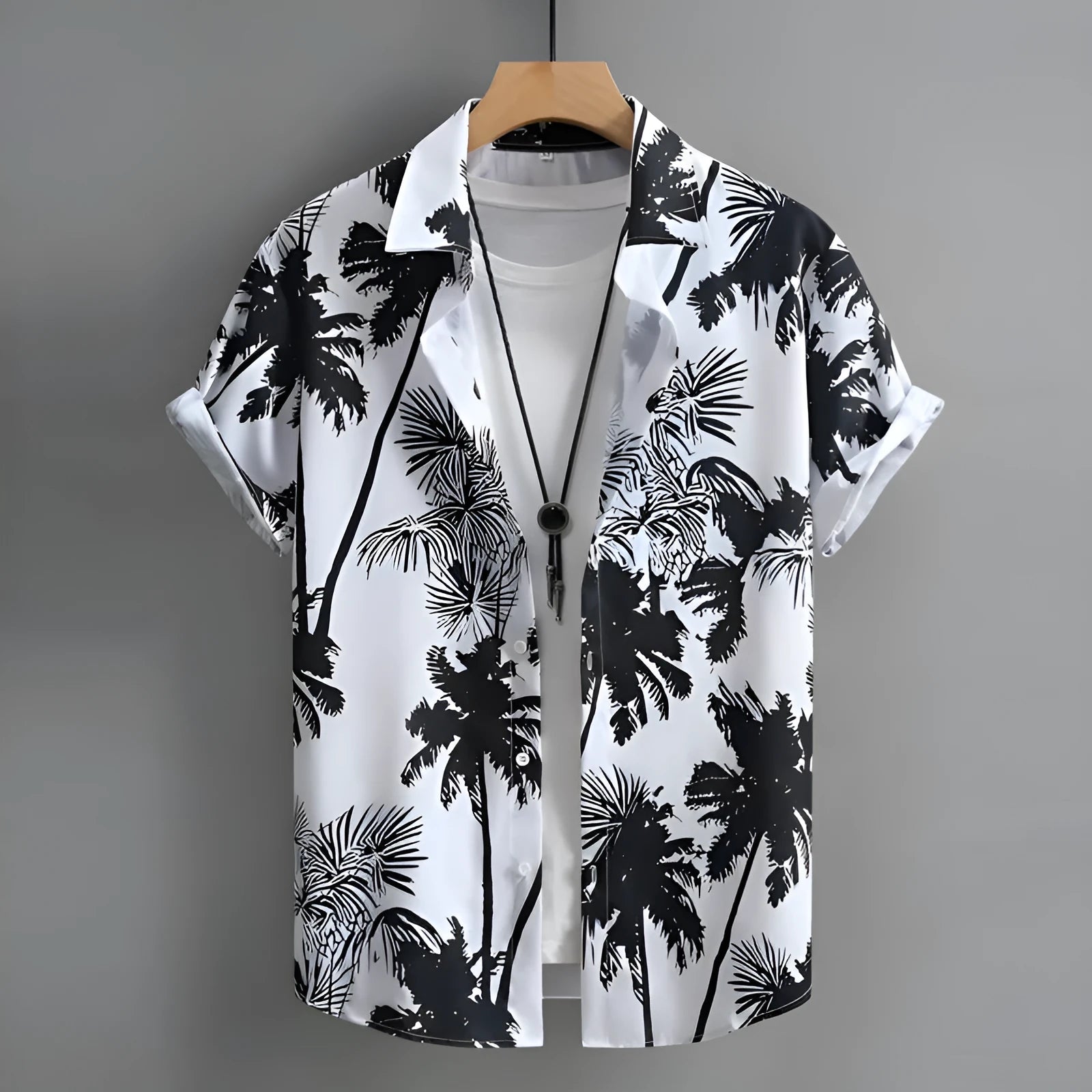 Man wearing a short-sleeved Hawaiian shirt with colourful 3D printed patterns.