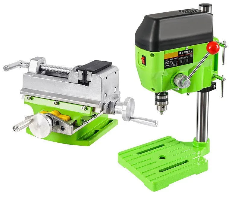Mini bench drill and milling machine with heavy duty bench pliers on a workbench.