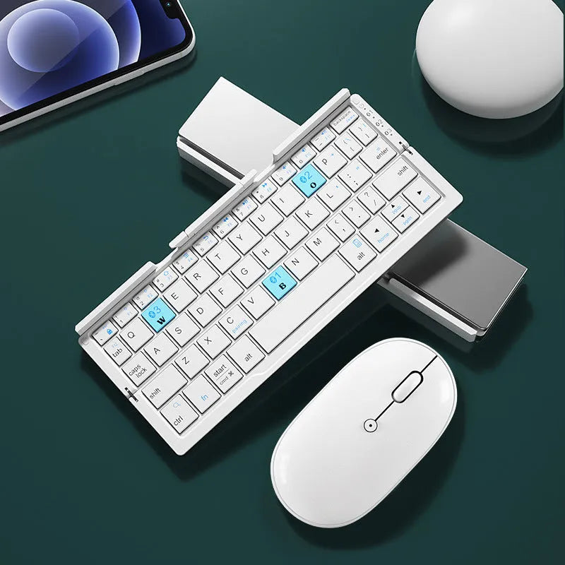 Silver white folding Bluetooth keyboard shown open with stand supporting a smartphone