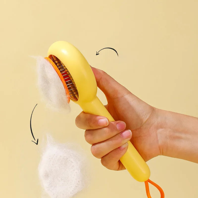 Small yellow duck-shaped pet comb with open needle design for cat and dog grooming