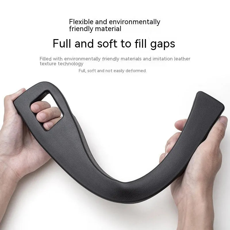 Black plastic car seat gap storage organiser box with handle between vehicle seats