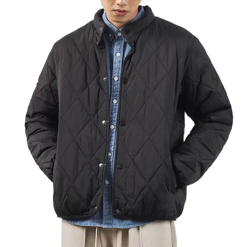Men's black diamond lattice quilted winter jacket with a loose, longline fit on a hanger.