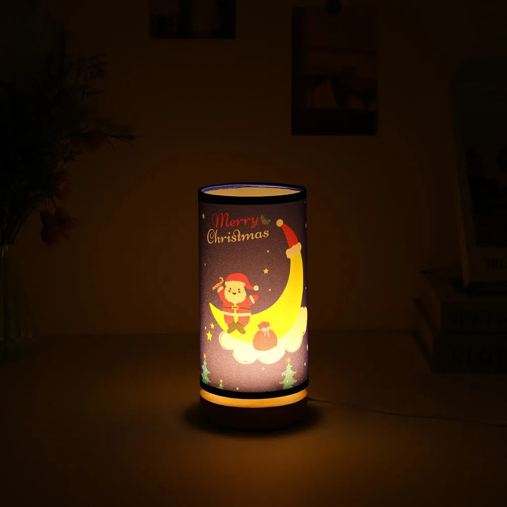 Moon and Santa Claus themed LED night light with a bamboo base and USB plug cable.