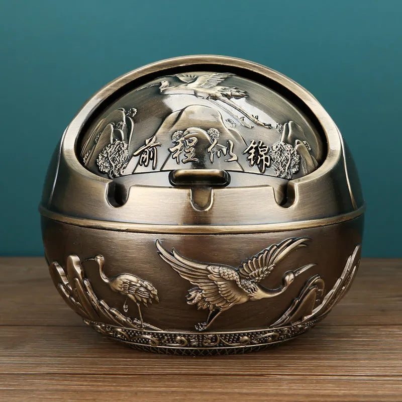 Bronze alloy ashtray with decorative fortune tree design and smoke extinguishing slot.