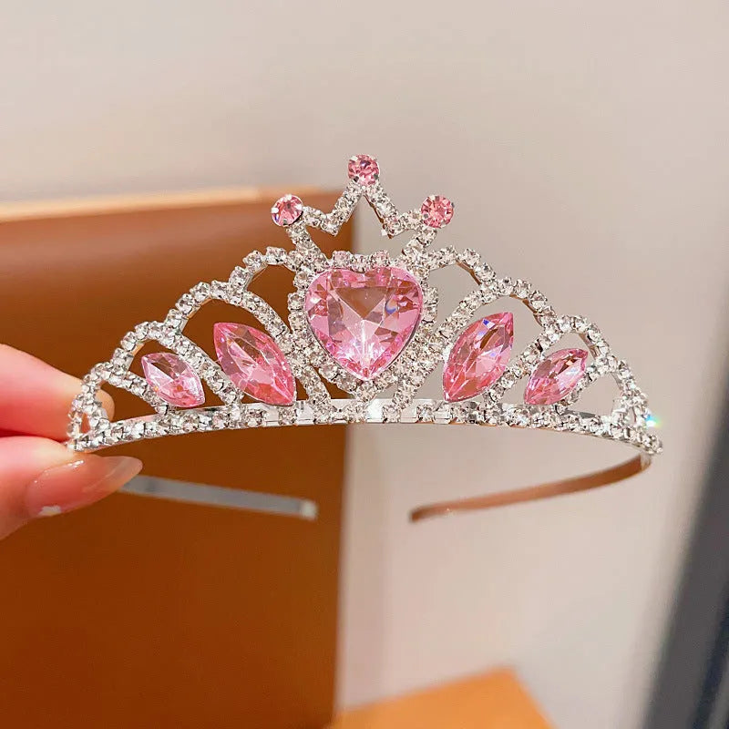 Girl's shiny metal headband with a crystal crown design in pink, light blue, and light purple colours.