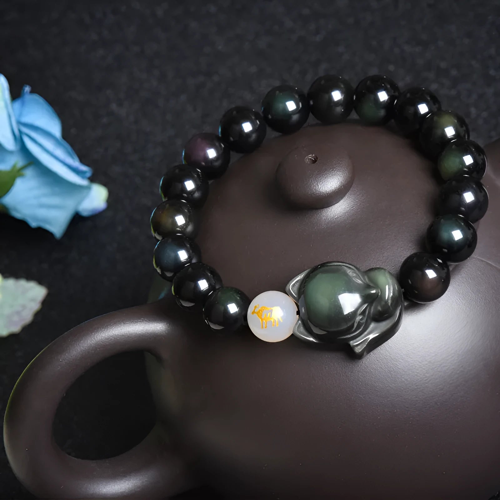 Natural obsidian bracelet with zodiac charm in gold, silver, or black stone styles.