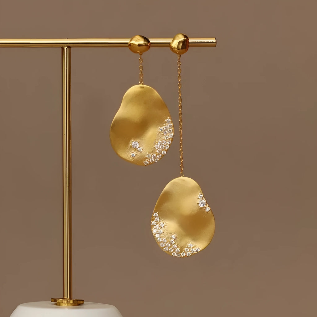 Asymmetric Chinese style earrings with gold-plated finish and zircon flower design in silver tone