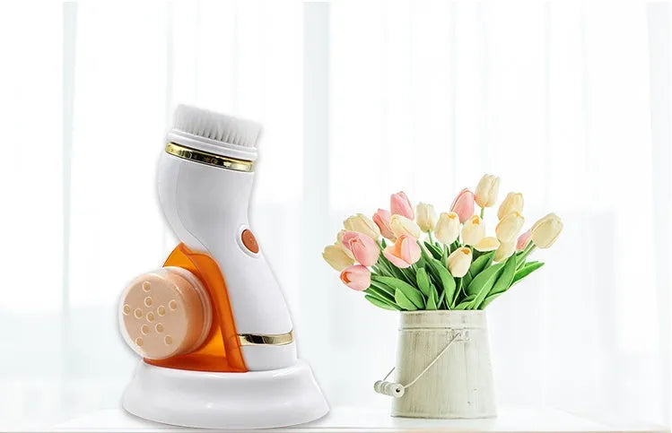 Ultrasonic electric pore cleaner in blue and orange with three brush heads and two gear speed settings for blackhead removal