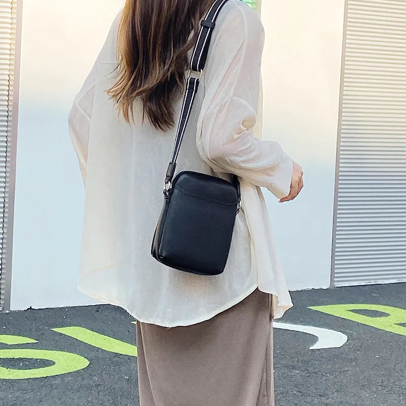 Solid colour PU leather crossbody phone bag in beige, shown with adjustable strap.