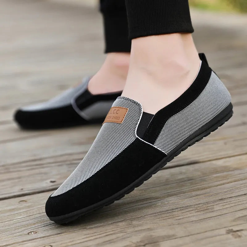 Men's grey and khaki canvas board shoes with round toe and rubber sole.
