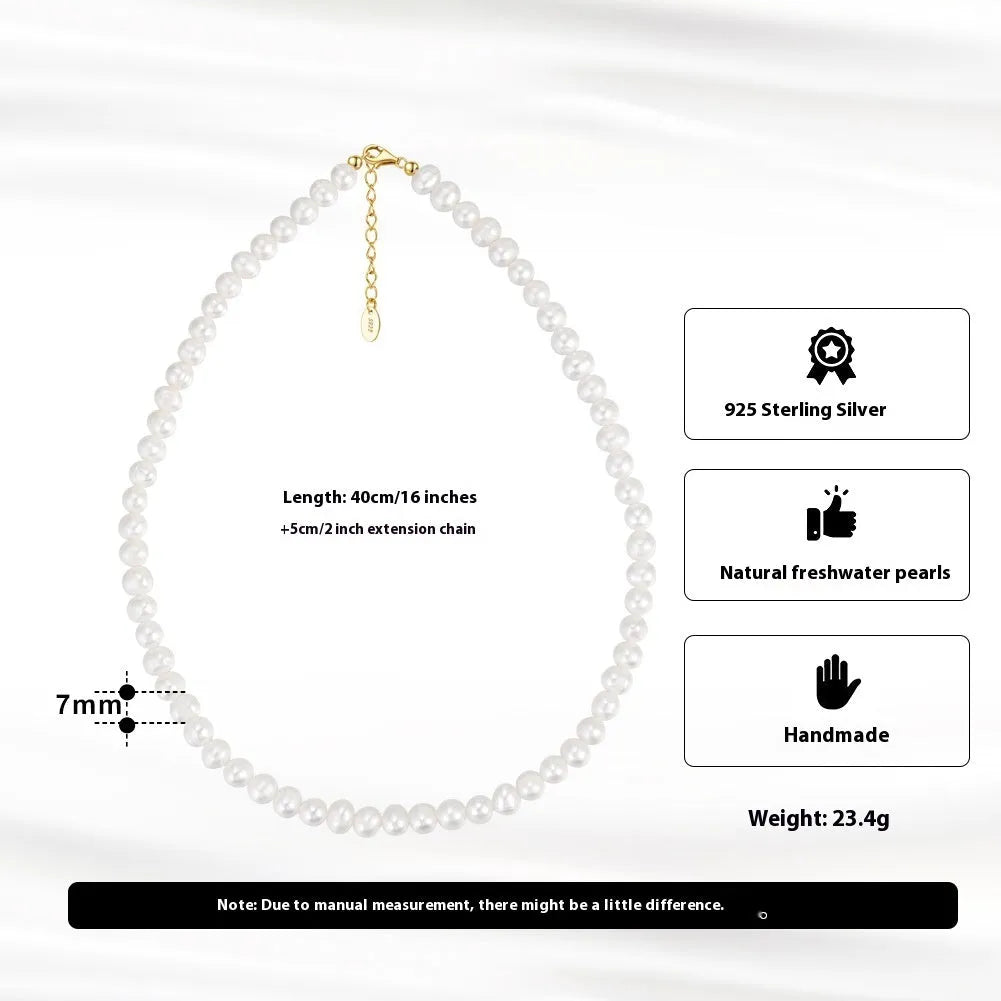 Women's silver necklace with a single round freshwater pearl and adjustable lobster clasp.