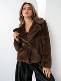 Women's short loose faux fur coat in rose red colour on a hanger.