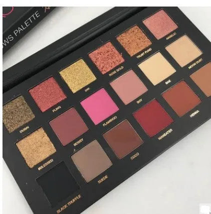 Desert Sun eye shadow palette open to show 12 warm neutral pans in matte and shimmer finishes with built-in mirror