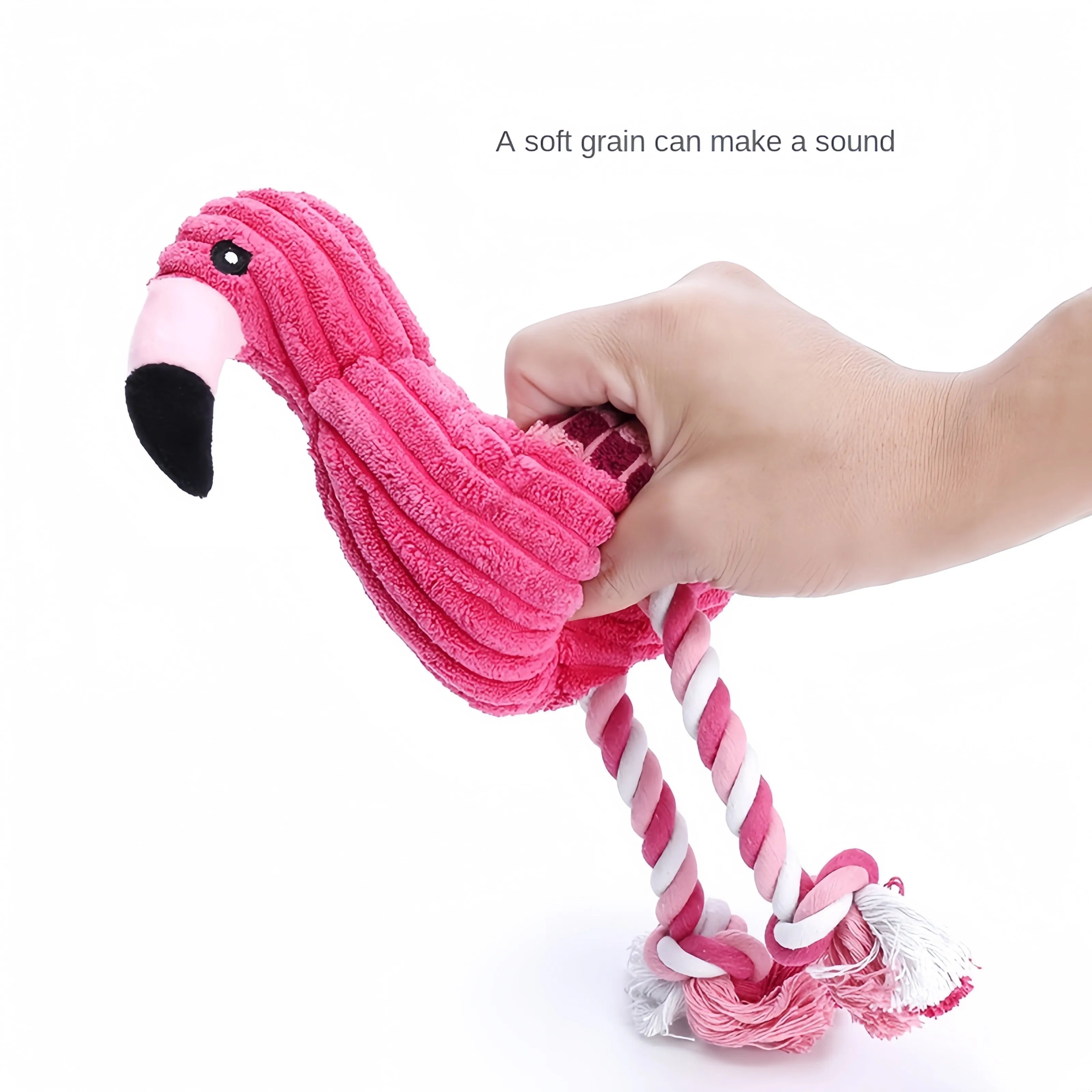 Pink corduroy animal-shaped plush dog toy with a squeaker inside on a neutral background.