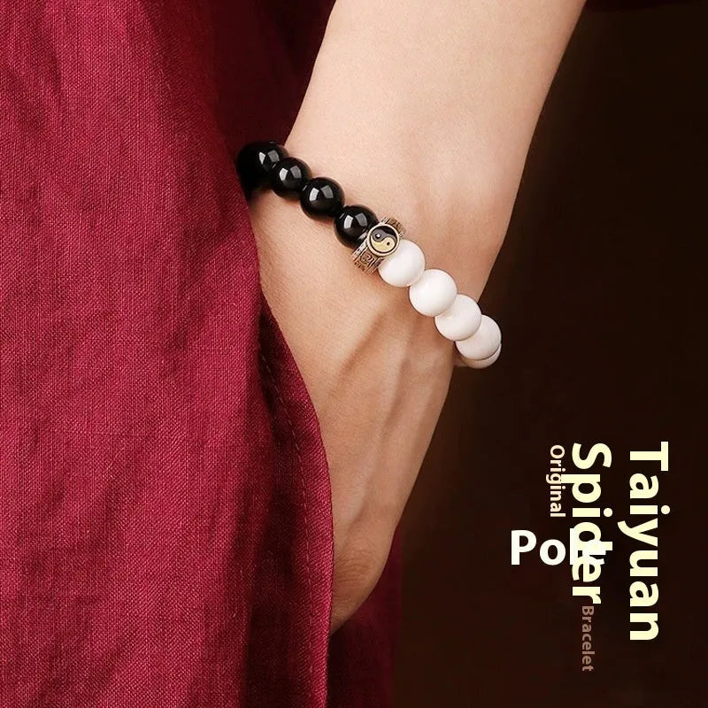 Geometric black and white obsidian Tai Chi bracelet with woven six-word mantra pattern