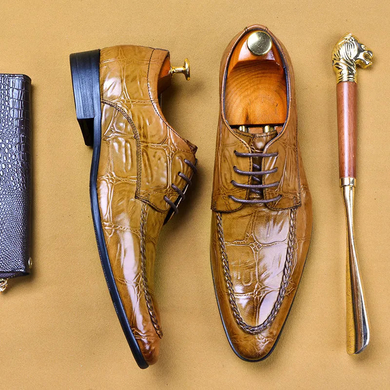 Men's brown leather loafers with a shiny horsebit buckle detail on the front, shown on a foot.