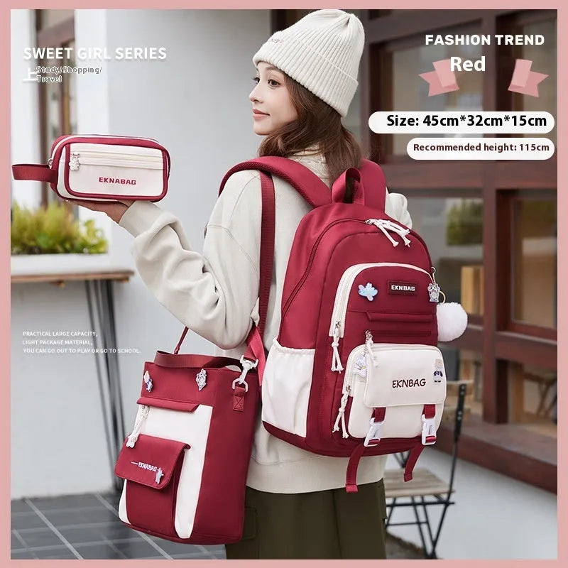 Pink waterproof Oxford cloth school backpack for girls with curved shoulder straps.