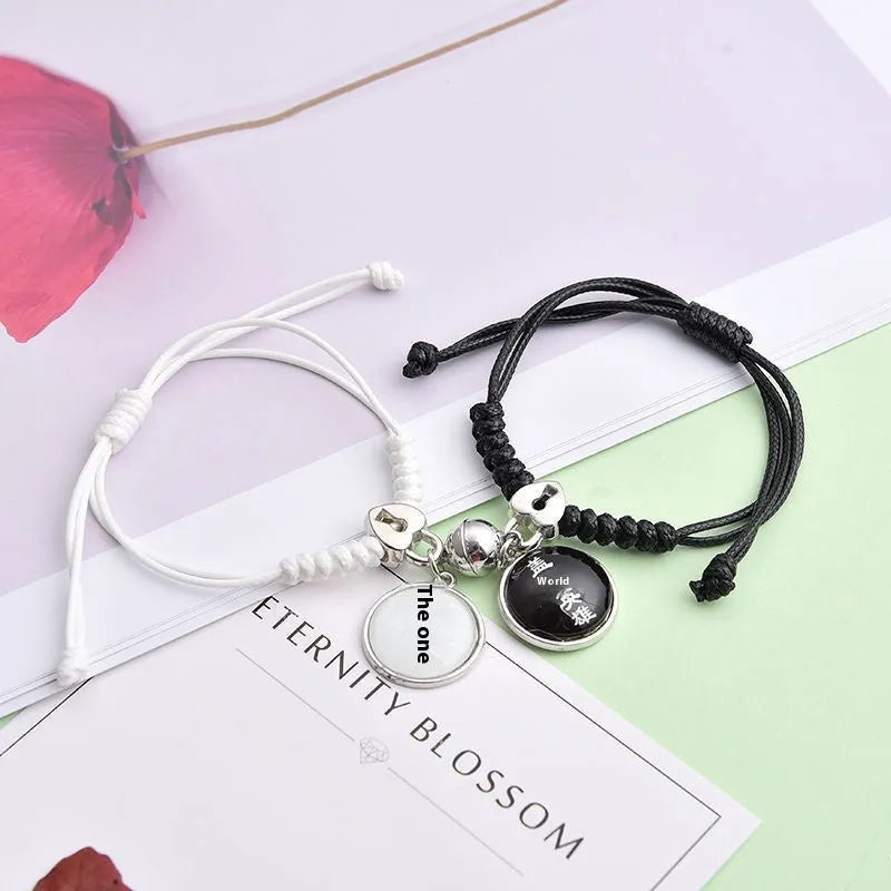 Magnet suction couple bracelets with alloy construction and various pendant designs including crowns and hearts
