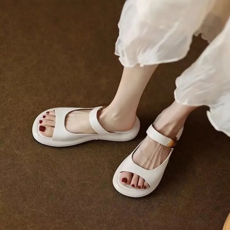 Women's apricot soft leather platform sandals with a peep toe and rubber sole.