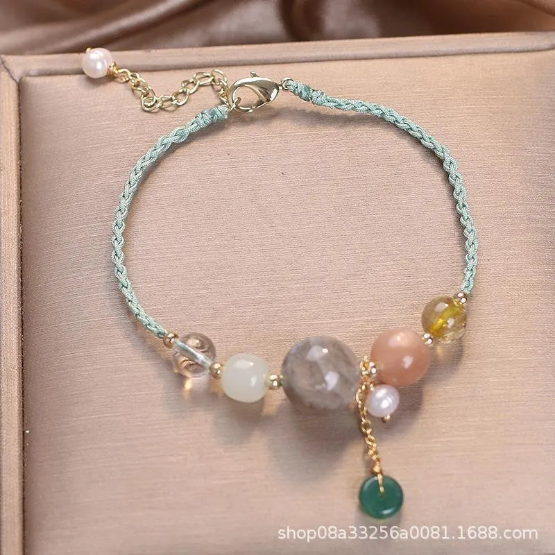Hand-woven women's crystal bracelet with peace buckle clasp and sequin accents