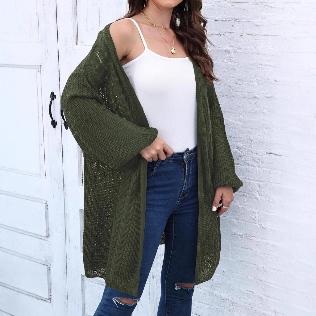 Women's loose acrylic sweater coat in a solid colour, shown in a casual style.
