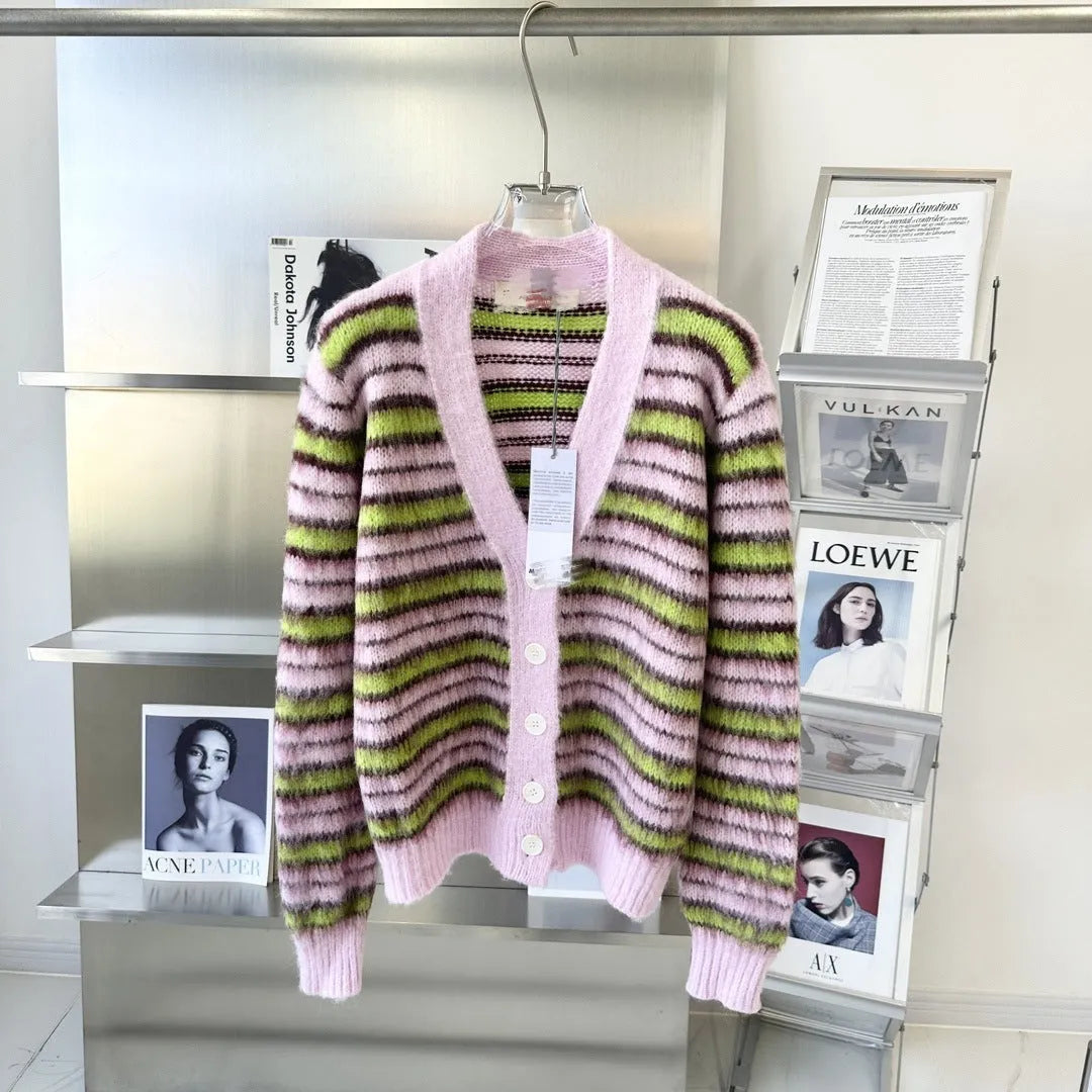 Pink lazy coat style wool blend cardigan with contrast colour detailing on a hanger.