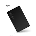 Black ultra-thin anti-loss alarm card for Apple devices next to a credit card for size comparison.