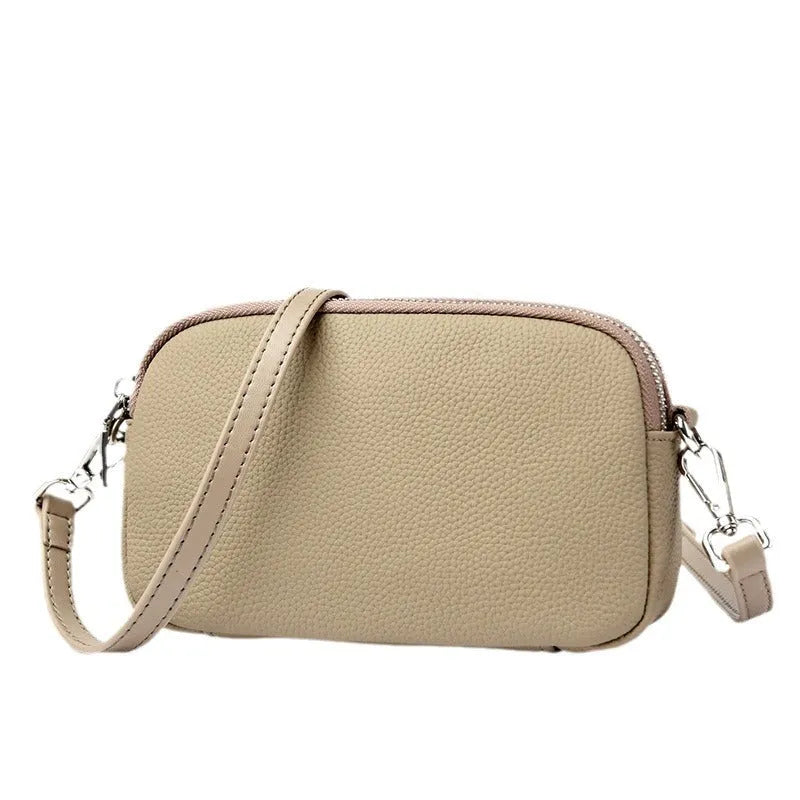 Small square shoulder messenger bag in first layer cowhide with sewing line detail