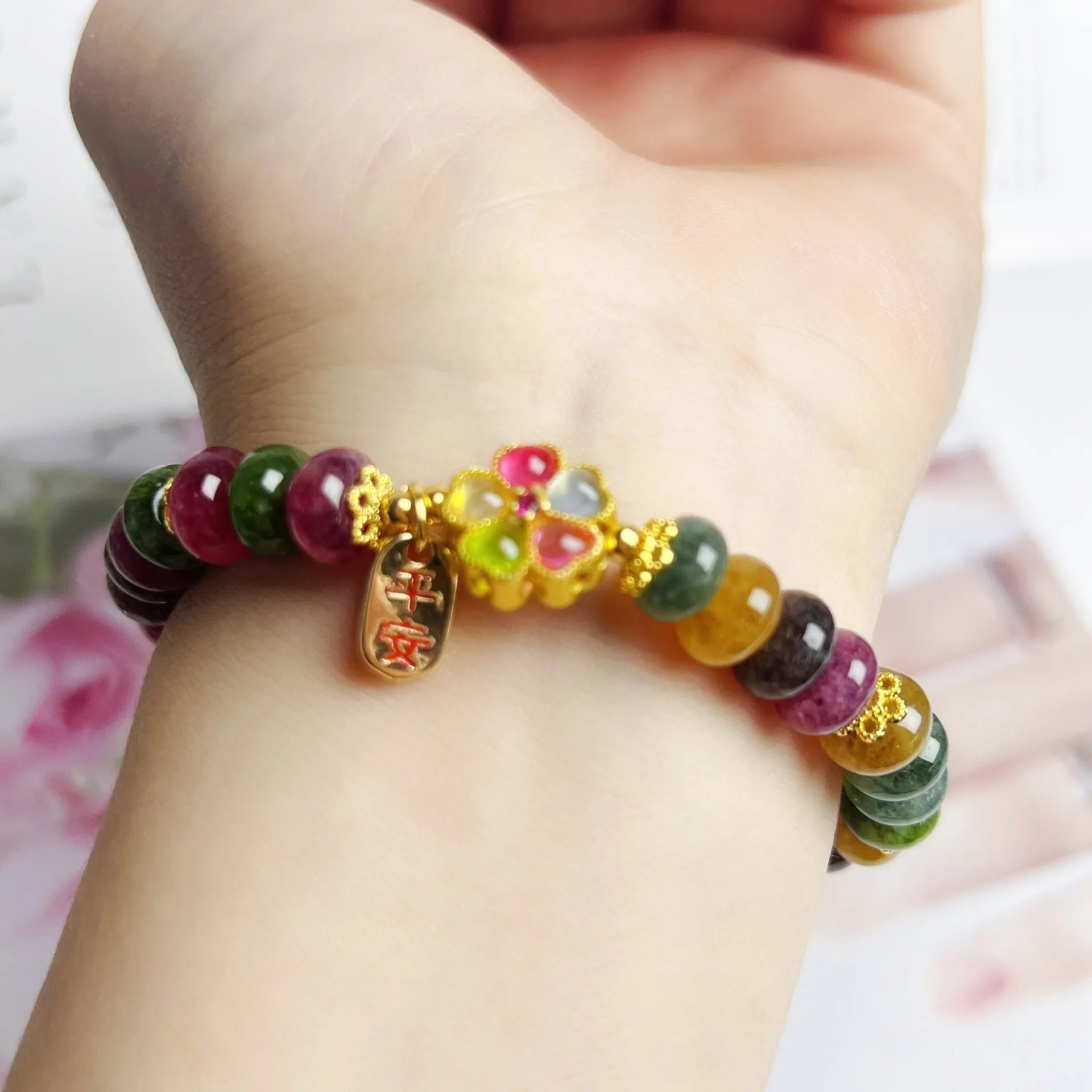 Colorful tourmaline abacus beads crystal stretch bracelet for women on a white background