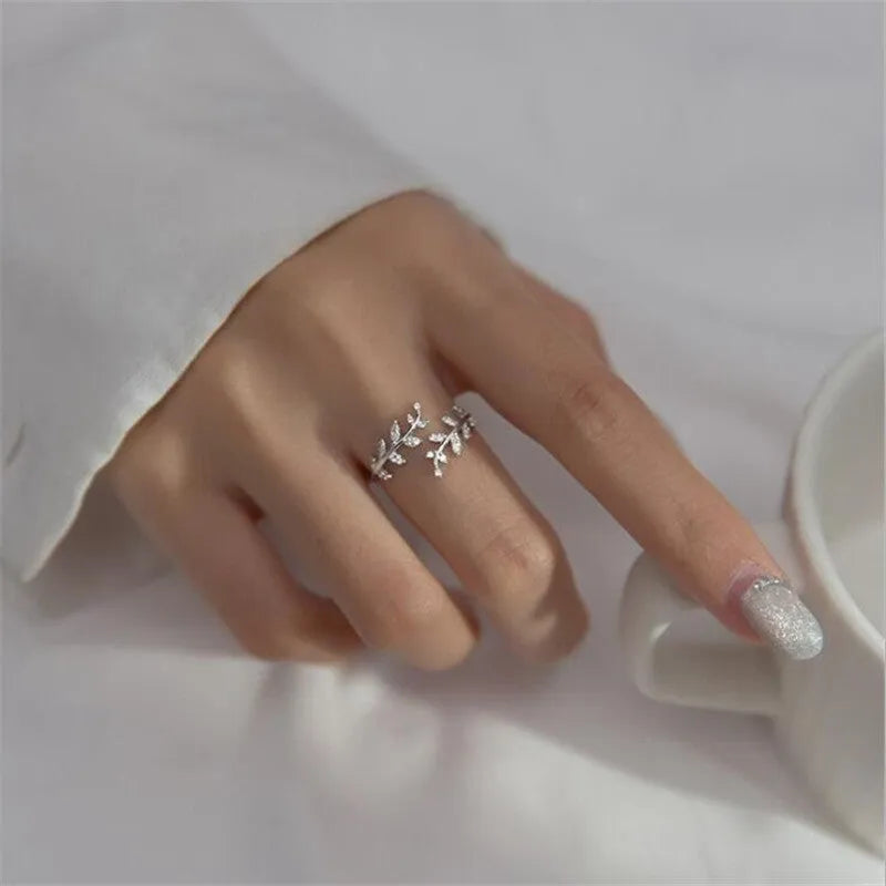 Women's leaf-shaped branch ring in electroplated copper, shown in silver and gold colour options.