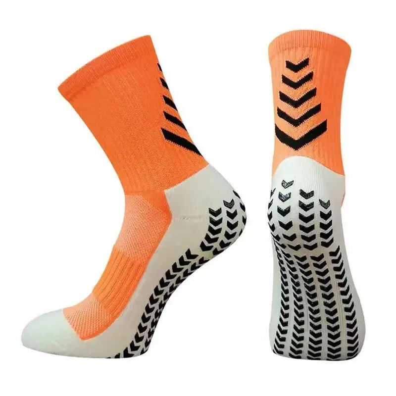 Men's black and green mid-calf athletic socks with a geometric pattern and non-slip silicone grip.