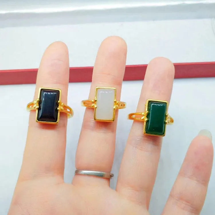 Gold-plated brass adjustable ring with a choice of black, green, or white gemstone inlays.