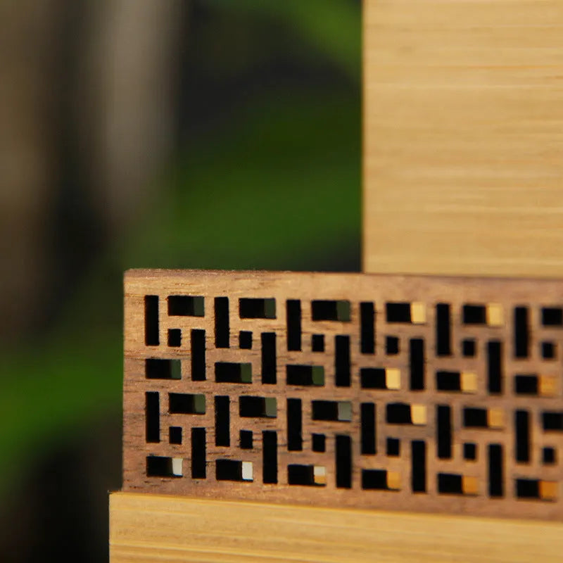 Geometric business cardholder made from bamboo and black walnut wood.