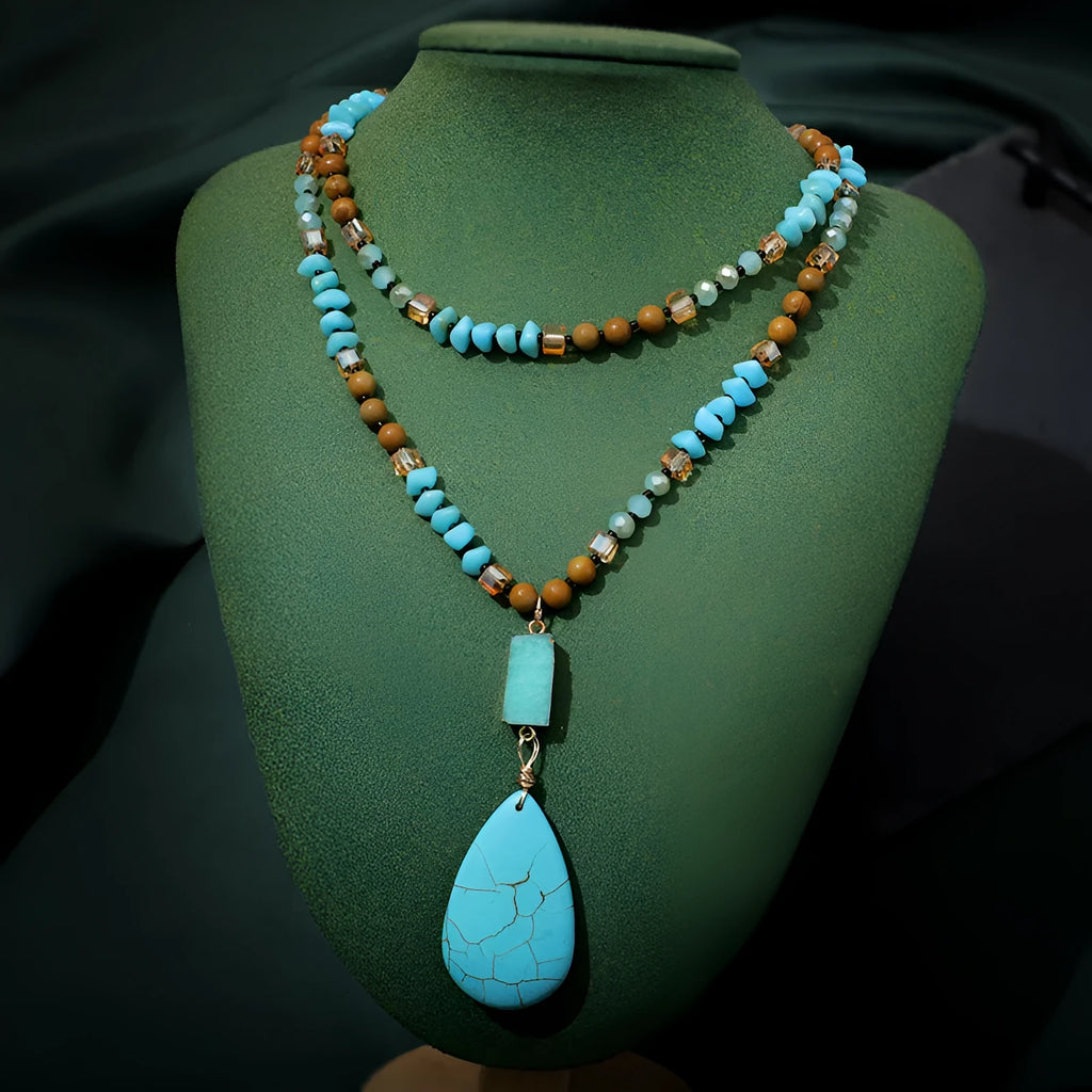 Blue turquoise imitation mineral necklace with large water drop pendant and ball bead chain.