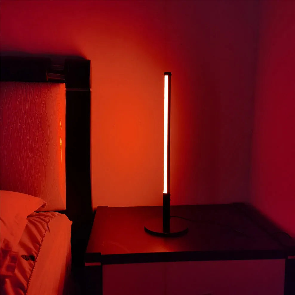 Simple retro black decorative atmosphere lamp with aluminium alloy body on a side table.