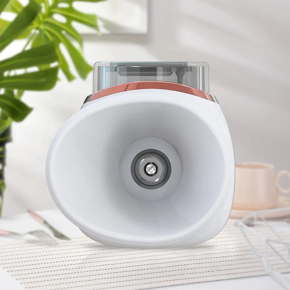 White and purple household eye humidifier with charging cable on wooden table