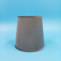Modern minimalist fabric lampshade in a grey colour on a table lamp base.
