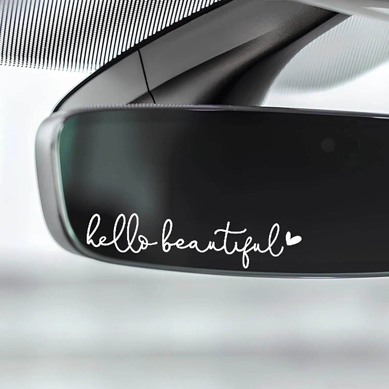 Plastic rearview mirror sticker 10x3cm in black on a car mirror