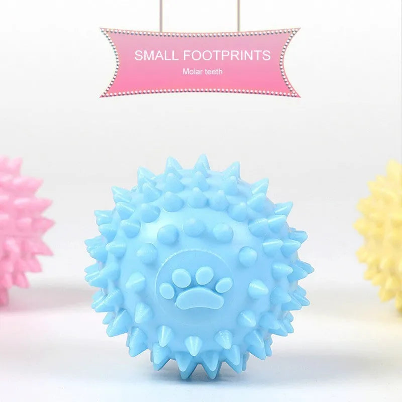 Blue TPR dog chewing ball with textured footprint design for teeth cleaning, 6cm diameter