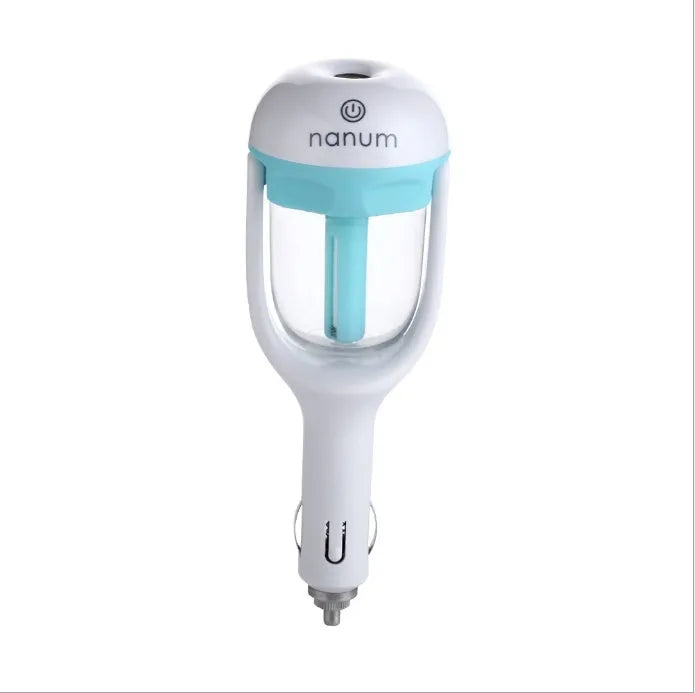 Compact blue portable car humidifier with essential oil diffuser on a car dashboard.