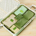 Set of six nylon packing cubes in different sizes and colours for travel organisation