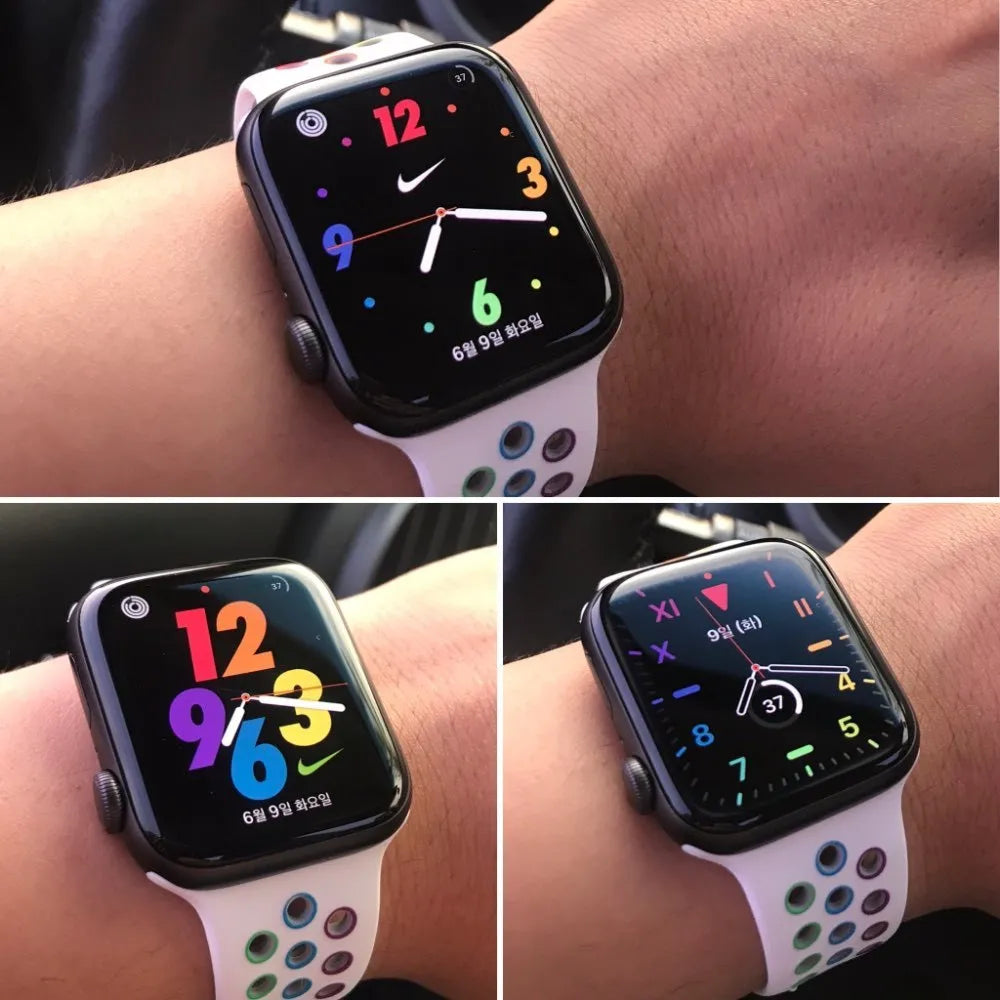 Black silicone sports wristband with a single buckle, shown alongside rainbow and white colour options.