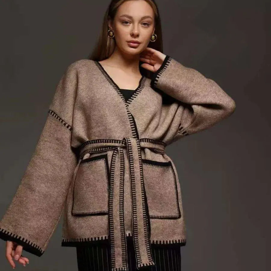 Lace-up front knitted cardigan in black, camel, or white, showing loose fit and thick fabric.