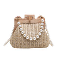 Women's woven straw shoulder bag with pearl chain detail showing horizontal square shape and multiple internal pockets