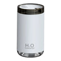 White jellyfish-shaped USB humidifier with warm night light on wooden surface