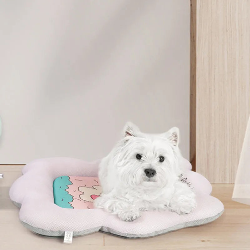 Green pet cooling mat for a medium-sized dog resting on an ice silk surface.