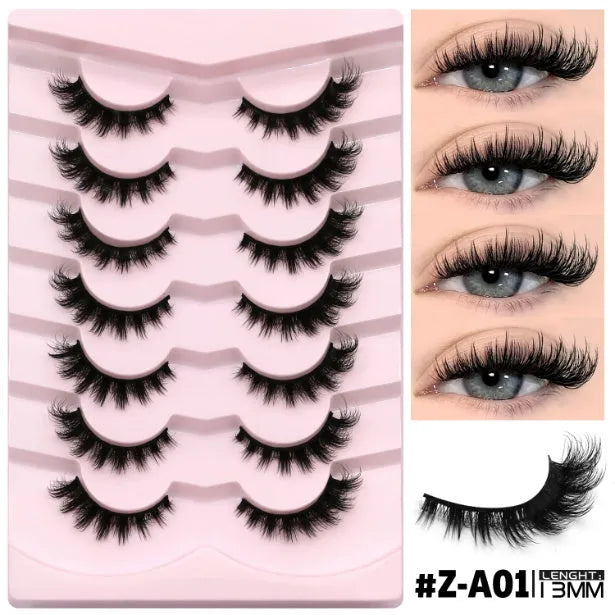 Box of natural false eyelashes with thick artificial fibre lashes and included glue tube