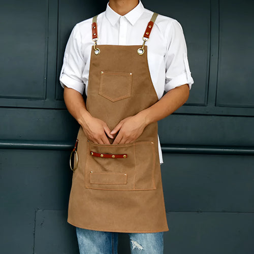 Canvas apron with cross-back straps in camel colour